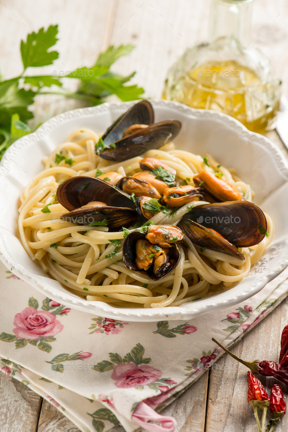 spaghetti with mussels traditional italian recipe Stock Photo by